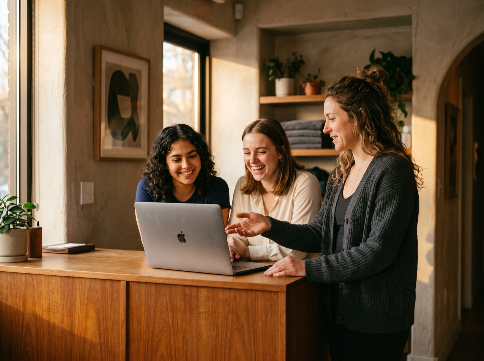 A team running their new system together at a front desk